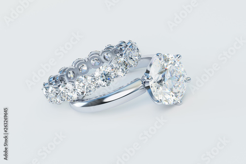Typical solitaire diamond engagement ring, eternity wedding band, on white background. 3D rendering