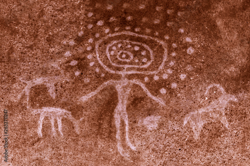 The image of an ancient man on the wall of the cave. ancient art, history, archaeology.