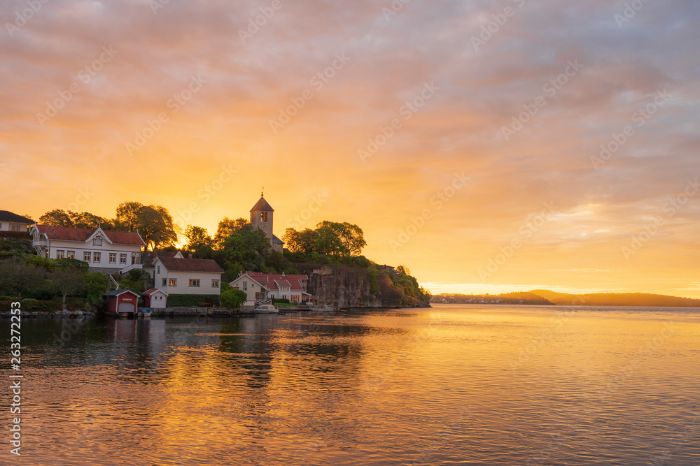 Fototapeta premium Sunrise with clouds sky with old building in foreground.