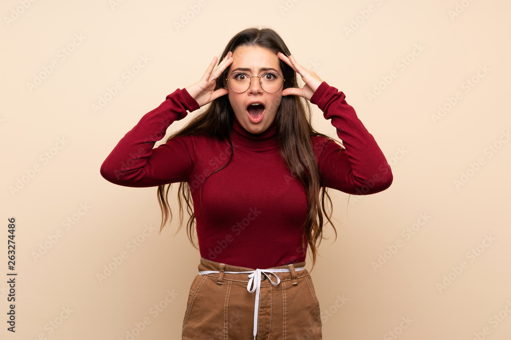 Teenager girl with glasses with surprise expression Teenager girl with glasses with surprise expression