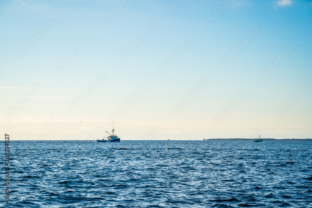 Lobster fishing boat scenery of Canada's Atlantic coast with a beautiful sky. Lobster fishing boat scenery of Canada's Atlantic coast with a beautiful sky.