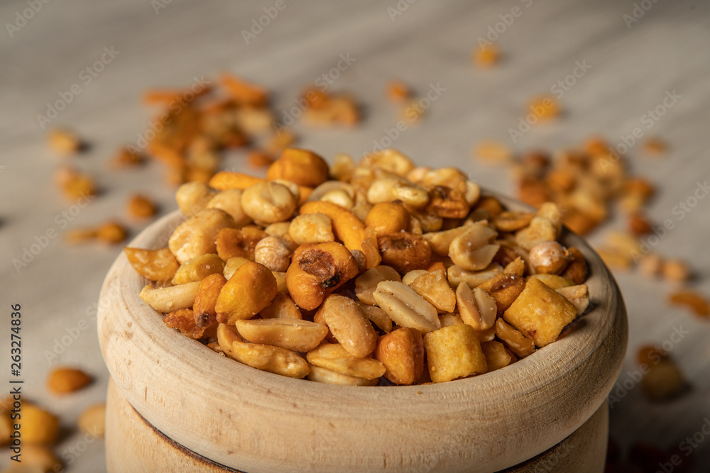 Obraz premium dried fruit in wooden bowl, snack for between meals
