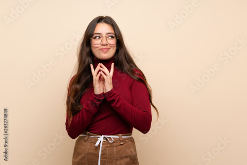 Fotografija Teenager girl with glasses scheming something