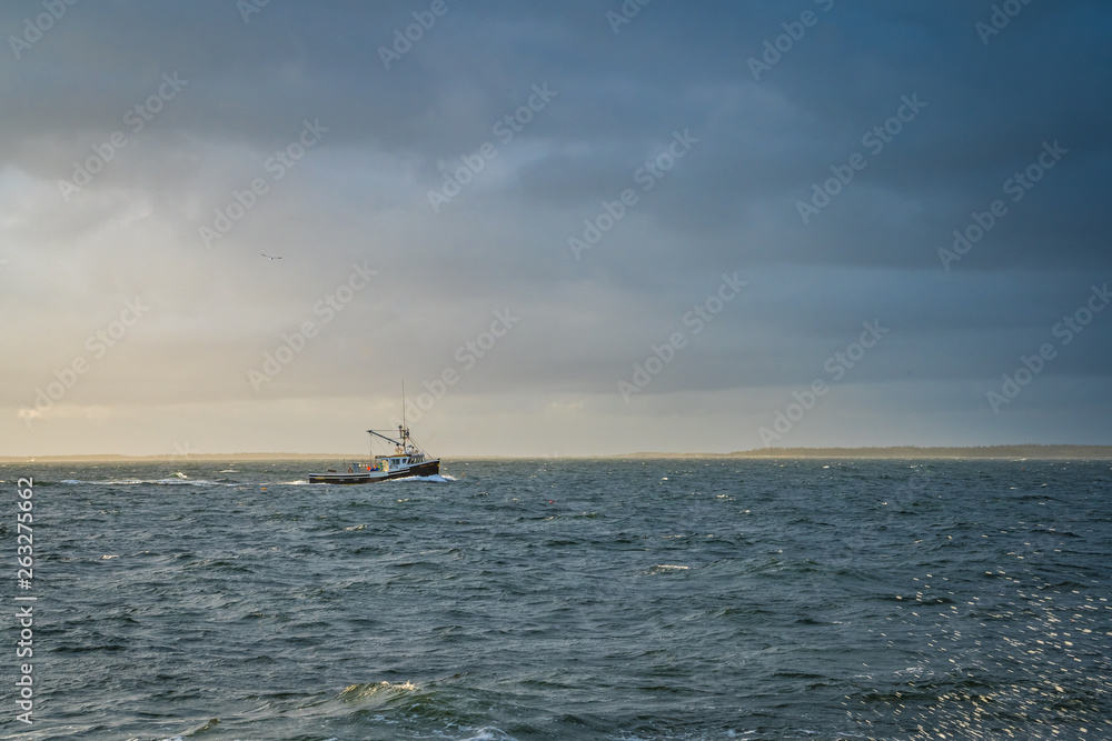 Lobster fishing boat scenery of Canada's Atlantic coast with a beautiful sky.