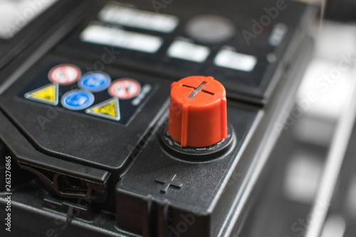 car battery with positive red contact for the repair of the machine