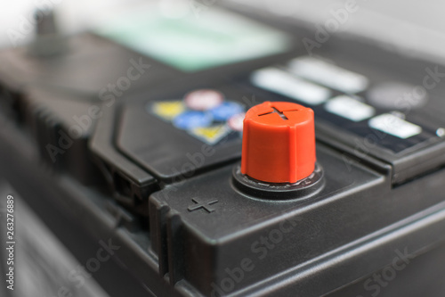 car battery with positive red contact for the repair of the machine
