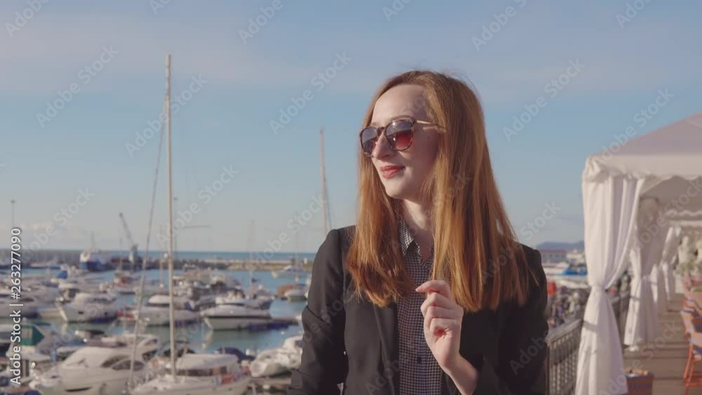 Beautiful young girl in port on vacation. Beautiful young girl in port on vacation.