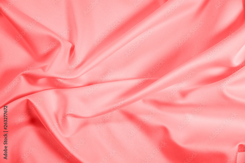 Closeup of rippled coral satin fabric Closeup of rippled coral satin fabric