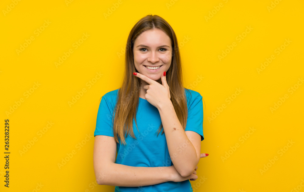 Young woman with blue shirt laughing Young woman with blue shirt laughing