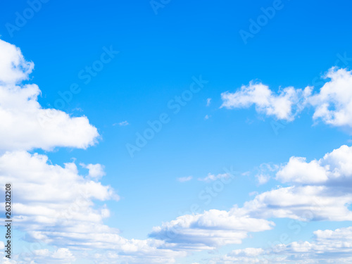 wedge of white clouds in blue sky