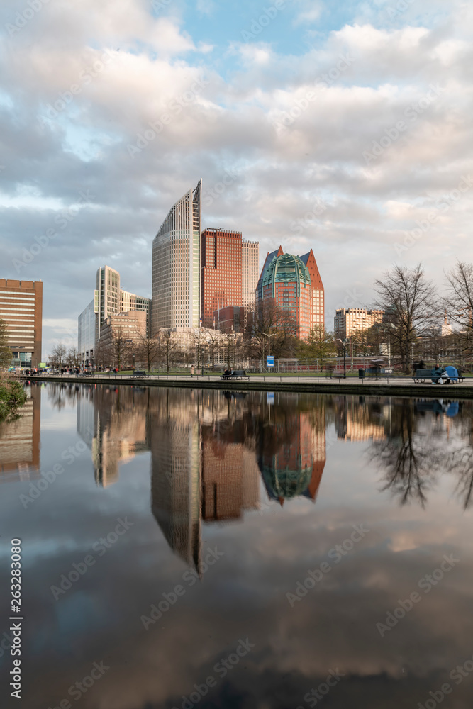 Sunrise on The Hague cityscape reflected on the water at the spring season