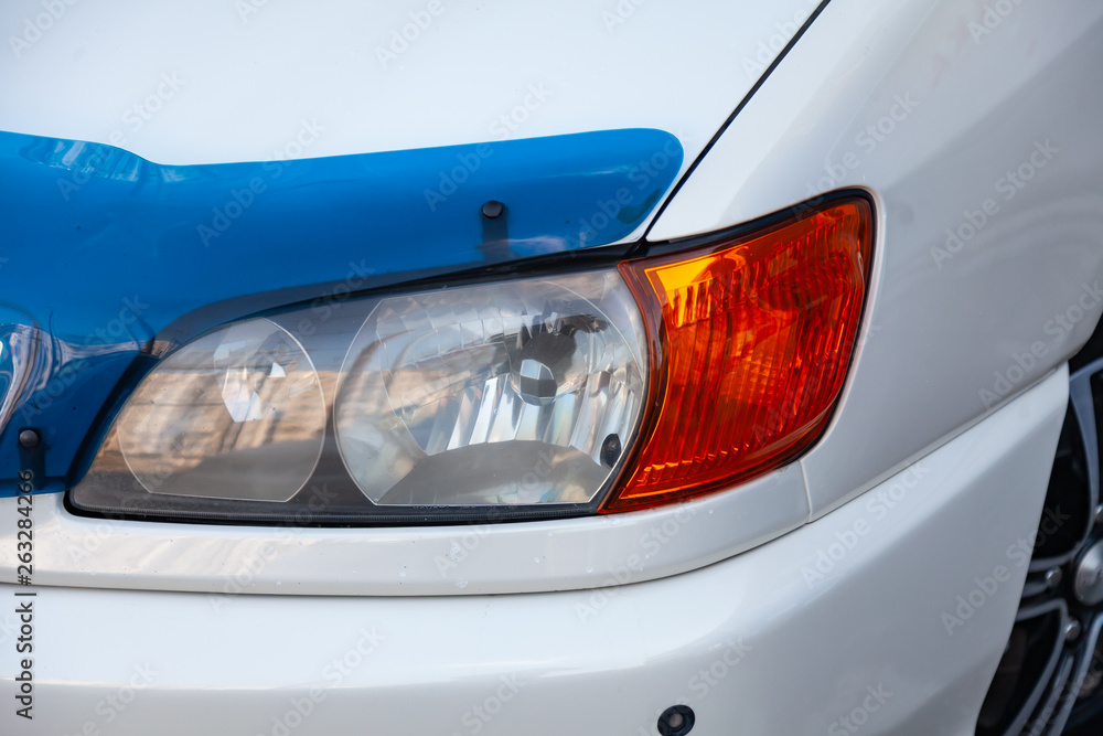 Front view of car in white color after cleaning before sale on parking