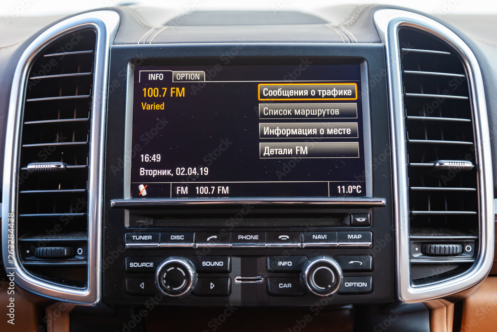 The interior of the car with a view of the steering wheel, dashboard, seats and multimedia system with light brown leather trim The interior of the car with a view of the steering wheel, dashboard, seats and multimedia system with light brown leather trim