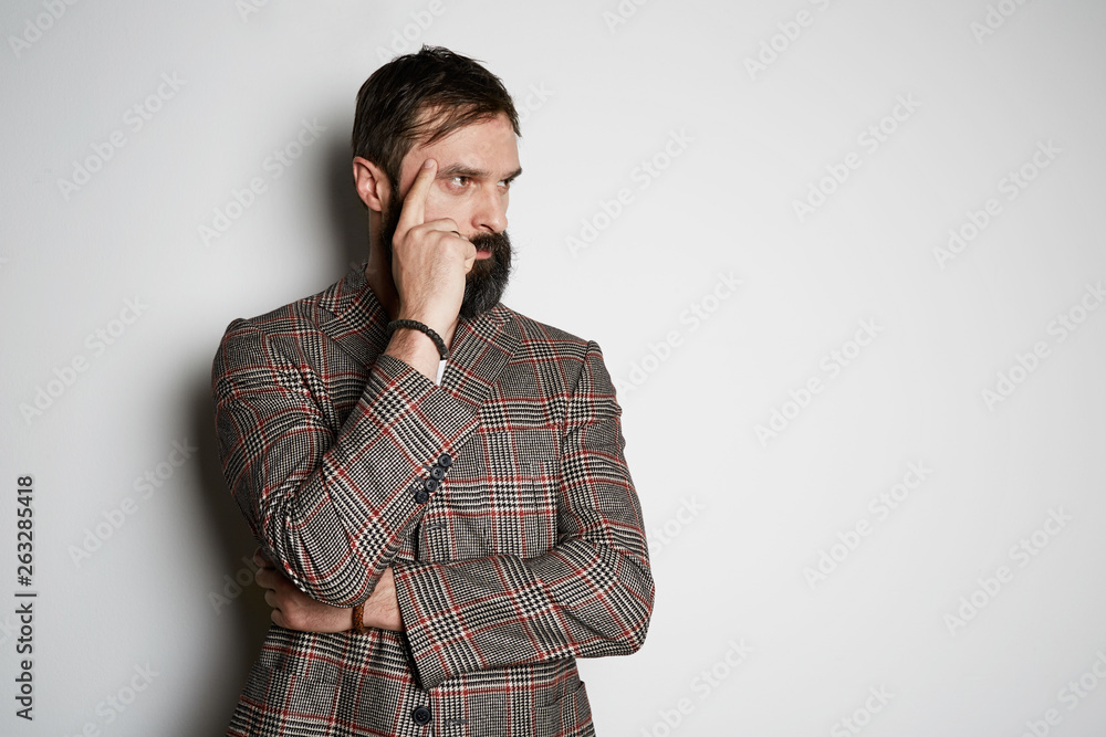 Portrait of bearded businessman model poses in casual jacket and blank white t-shirt premium summer cotton, on white background. Mockup Copy Paste Advertisement Portrait of bearded businessman model poses in casual jacket and blank white t-shirt premium summer cotton, on white background. Mockup Copy Paste Advertisement