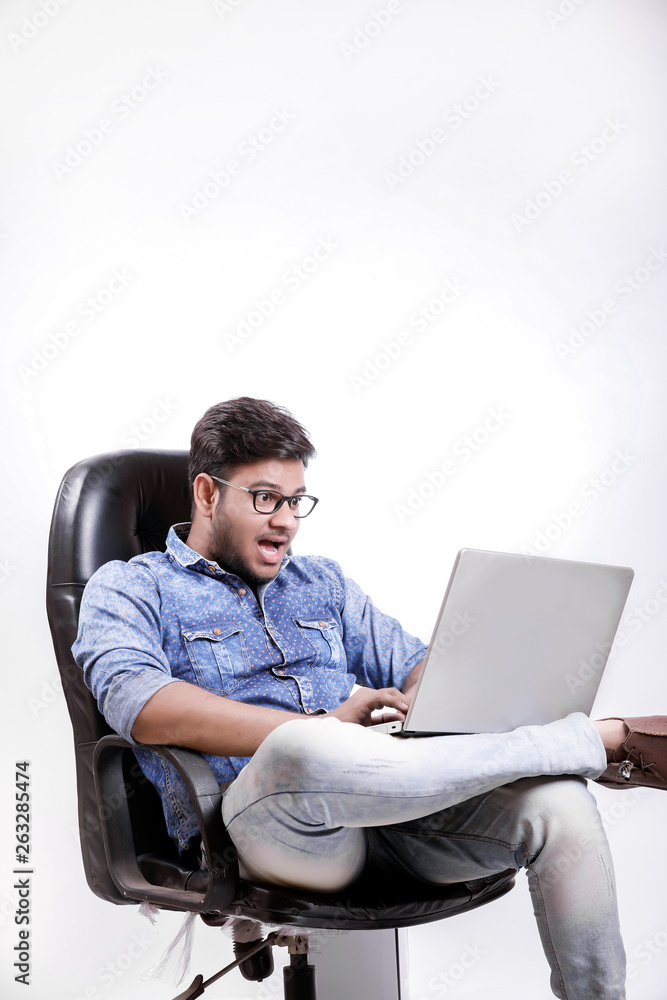  Young Indian man using laptop