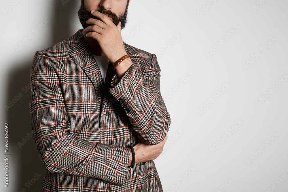 Young bearded businessman model poses in casual jacket and blank white t-shirt premium summer cotton, on white background. Mockup Copy Paste Advertisement Young bearded businessman model poses in casual jacket and blank white t-shirt premium summer cotton, on white background. Mockup Copy Paste Advertisement