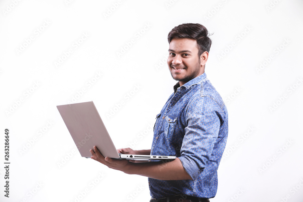  Young indian man with laptop