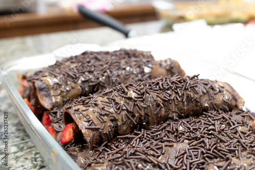 granulated chocolate pancake with strawberry