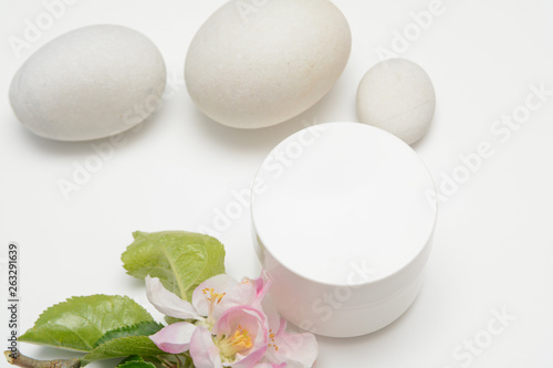 Beauty product container with blossom and nature theme
