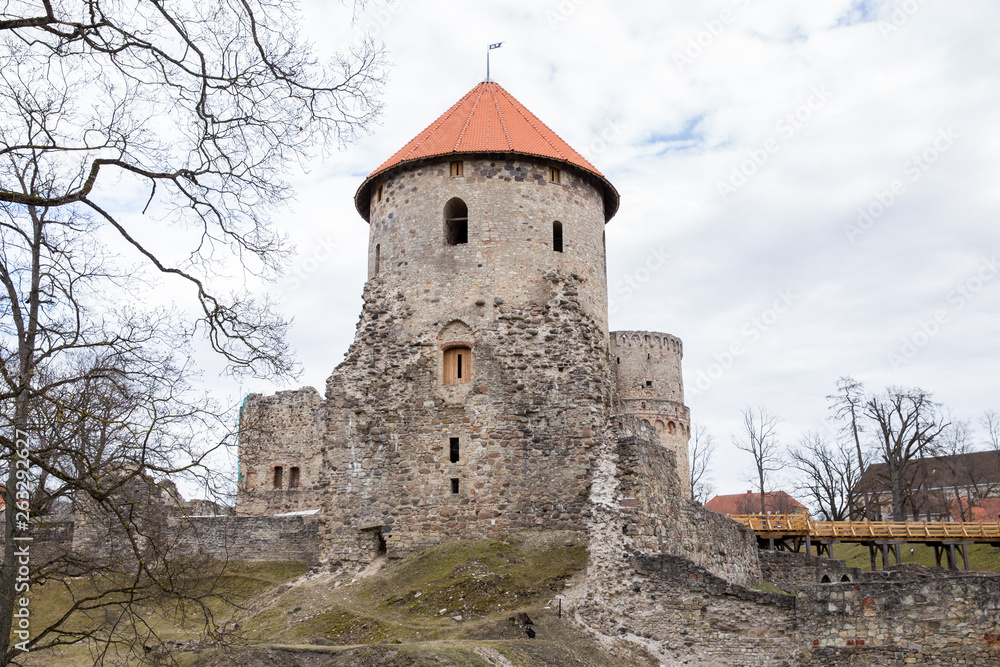Old castle and rocks in spring. Nature and historic building. Travel photo 2019.