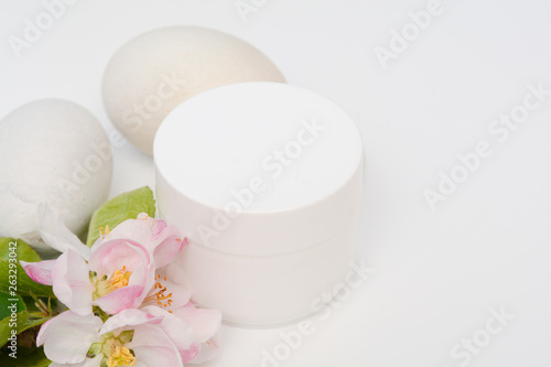 Beauty product container with blossom and nature theme
