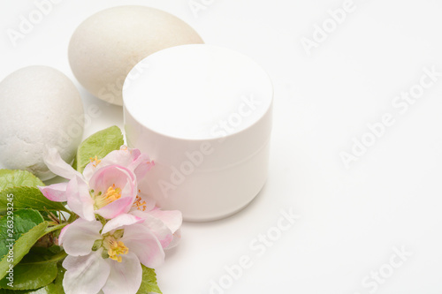 Beauty product container with blossom and nature theme