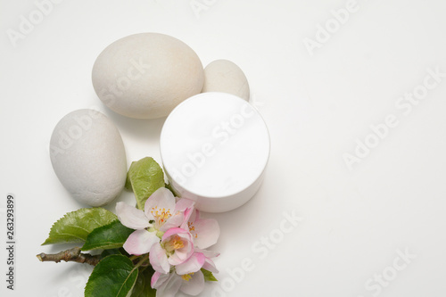 Beauty product container with blossom and nature theme
