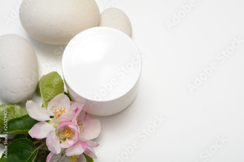 Beauty product container with blossom and nature theme