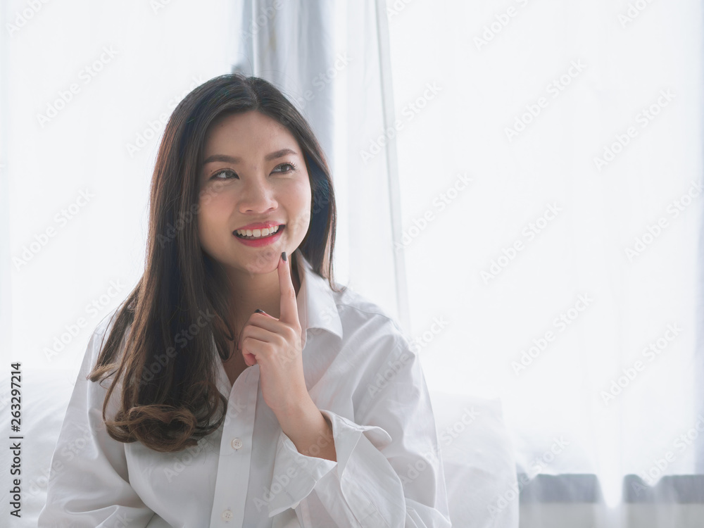 Closeup portrait of attractive young Asia woman smiling on morning weekend. Closeup portrait of attractive young Asia woman smiling on morning weekend.