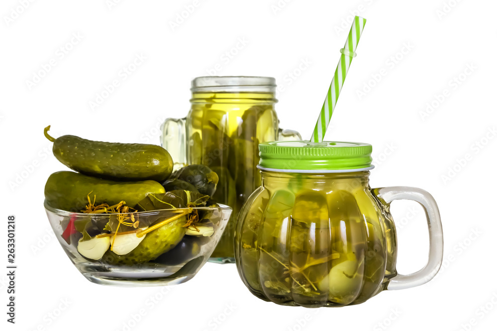 Cucumber pickle in a jar with a lid and a tube and pickled cucumbers in a plate isolated on white background Cucumber pickle in a jar with a lid and a tube and pickled cucumbers in a plate isolated on white background
