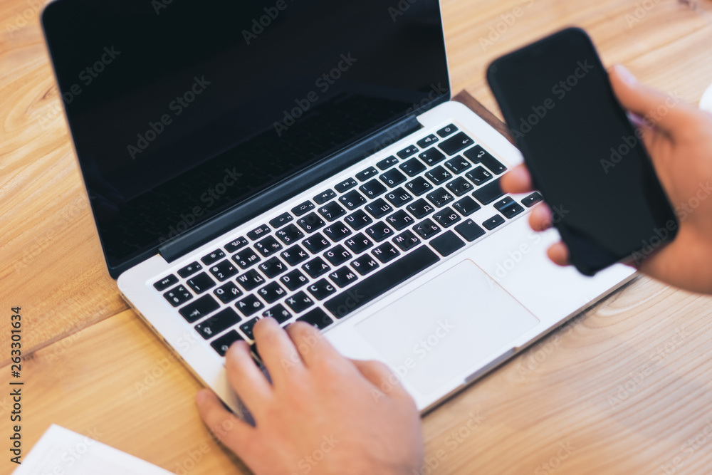 Man using empty laptop screen on desktop Man using empty laptop screen on desktop