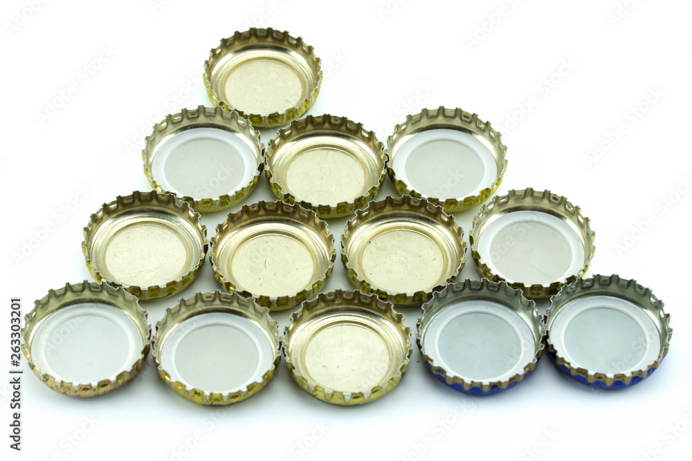 Metal cover from glass bottles. Decorative beer caps on white background. Metal cover from glass bottles. Decorative beer caps on white background.