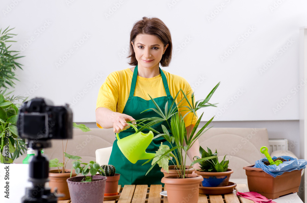 Female blogger explaining houseplants growing Female blogger explaining houseplants growing
