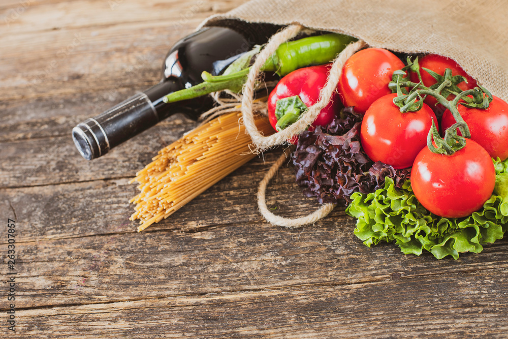 Many vegetables and fruits in the shopping bag on the table Many vegetables and fruits in the shopping bag on the table