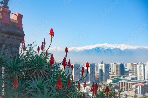 Obraz na płótnie Modern urban skyline of Santiago Chile from high point of view of San Cristobal Hill  overlooking downtown commercial centre with snow-capped Andes mountains in background