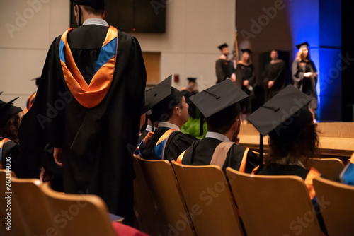 College graduates attend the commencement ceremony marking the end of their educations photo
