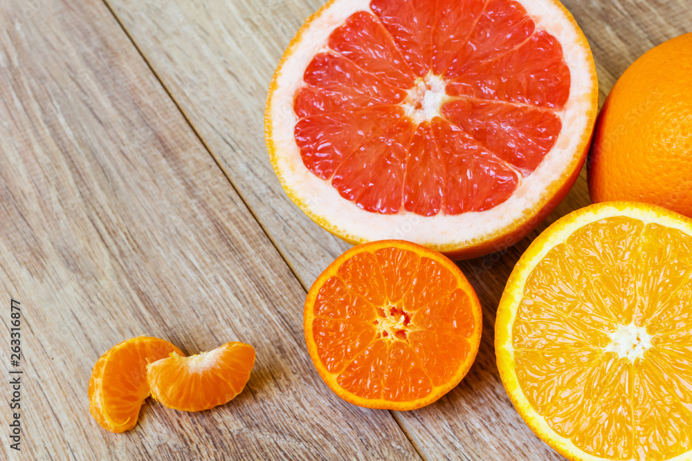 various citrus fruits on wooden table various citrus fruits on wooden table