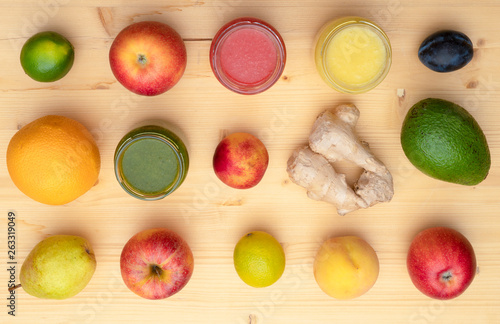 Detox red, orange and green smoothie drinks with fruits