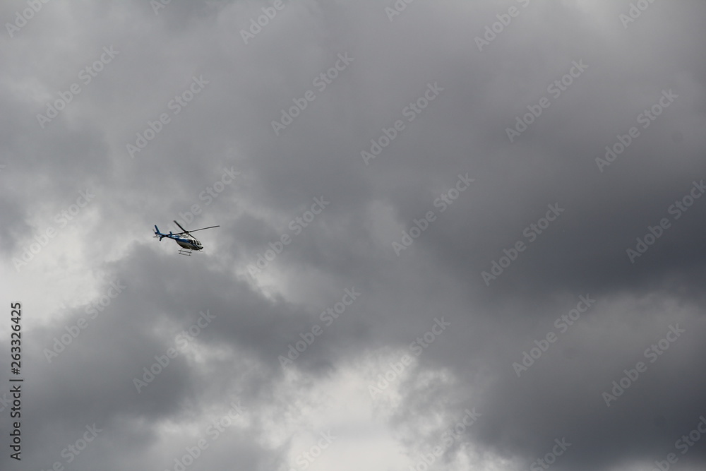 helicopter in the cloudy sky