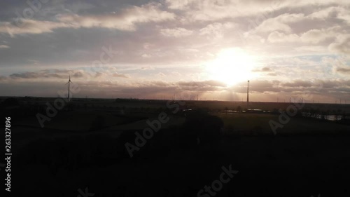 horizontally moving clouds at sunset, aerial view