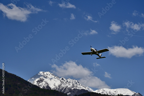Propeller plan over Valtellina mountains