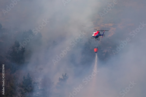 Helicopter extinguishing wildfire. Bergen, Norway.