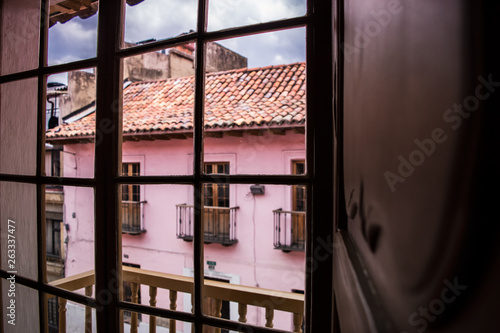 woman in window, dark day 