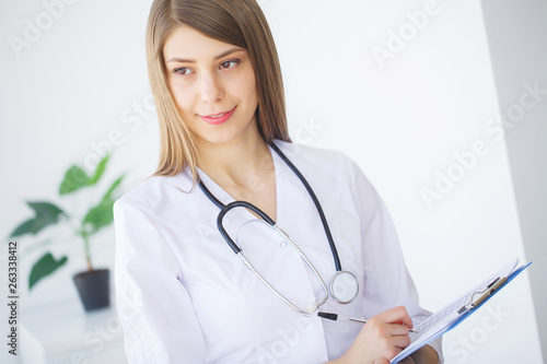 Medicine. Young female doctor in modern clinic