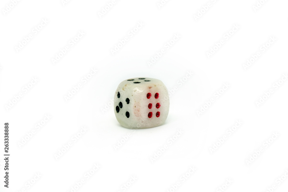 Dice with numbers four five six isolated on white background. Game cube made of natural stone. Ivory color with dots. Numbers four and five is black. Number six is red. Dice with numbers four five six isolated on white background. Game cube made of natural stone. Ivory color with dots. Numbers four and five is black. Number six is red.