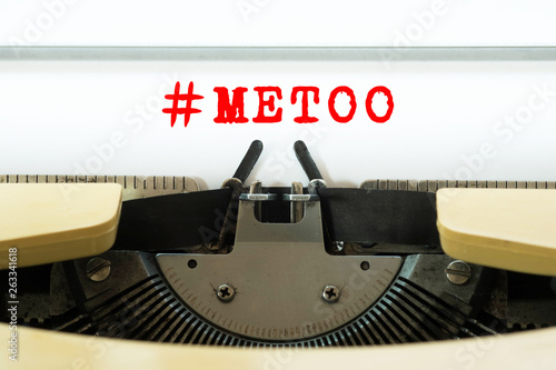 #METOO word typed on a yellow vintage typewriter. Business concept.