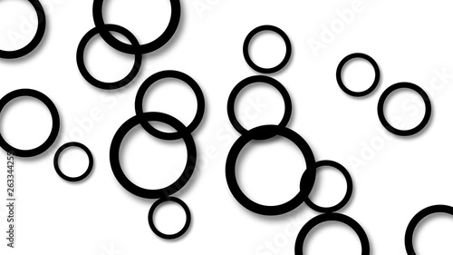 Abstract illustration of randomly arranged black rings with soft shadows on white background