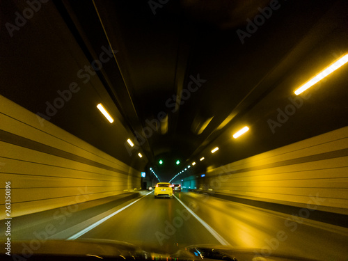 Speeding Cars Inside A Highway Urban Tunnel Motion Blur Background.