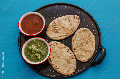 mexican tlacoyos with green and red sauce, Traditional food in Mexico photo