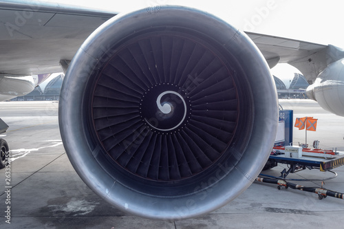 Front view of jet engine on airport background